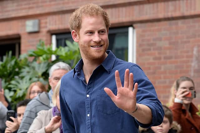 Prince Harry waves as he leaves Nottingham's new Central Police Station on October 26, 2016 