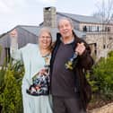 Omaze Million Pound House Draw Cornwall winner Rose Doyle with husband Tony outside their new home. 