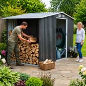 The spacious metal garden shed combines secure tool storage with a dedicated section for keeping logs dry and organised