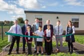 Pictured, from left, are Councillor Richard Ward, Matthew Antill, of Arc Partnership, Councillor James Walker-Gurley, Councillor Simon Wright, Councillor Rory Green and Leen Mills Primary School headteacher, Karen Goldson, with pupils cutting the ribbon.