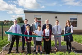 Pictured, from left, are Councillor Richard Ward, Matthew Antill, of Arc Partnership, Councillor James Walker-Gurley, Councillor Simon Wright, Councillor Rory Green and Leen Mills Primary School headteacher, Karen Goldson, with pupils cutting the ribbon.