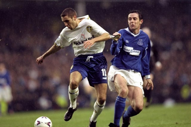 Darren Huckerby is pulled back by Everton's David Weir.
