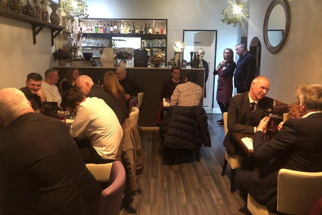 Everyone sits down to enjoy a feast at Rossi's. SUS-220902-115443001
