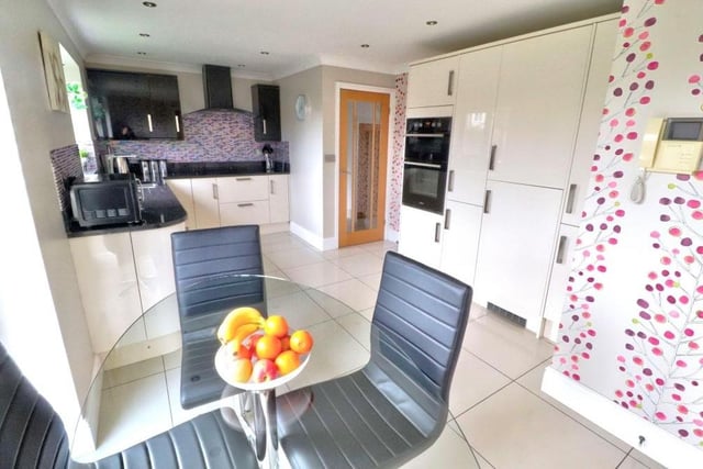 The property's modern dining kitchen boasts a range of cream gloss wall and base units, with matching drawers. Integrated appliances include a double oven, induction hob with extractor over, fridge freezer and dishwasher. There is more than enough space for a breakfast/dining table.
