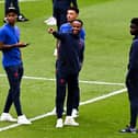 Marcus Rashford, Raheem Sterling, Jadon Sancho and Bukayo Saka of England speak during a pitch inspection prior to the Euro 2020 final (Photo by Facundo Arrizabalaga - Pool/Getty Images)