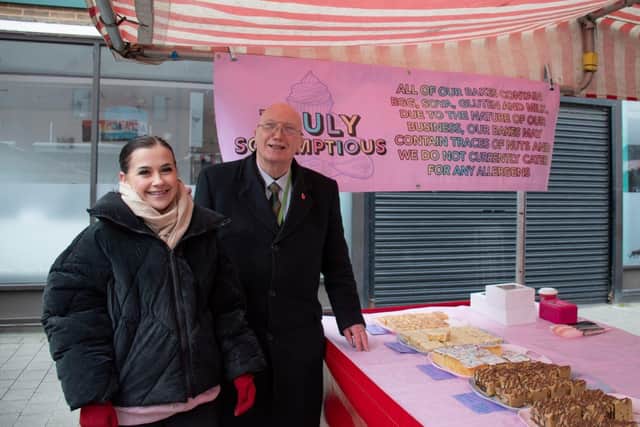 Hollie, owner of Truly Scrumptious, with Cllr John Willmott 