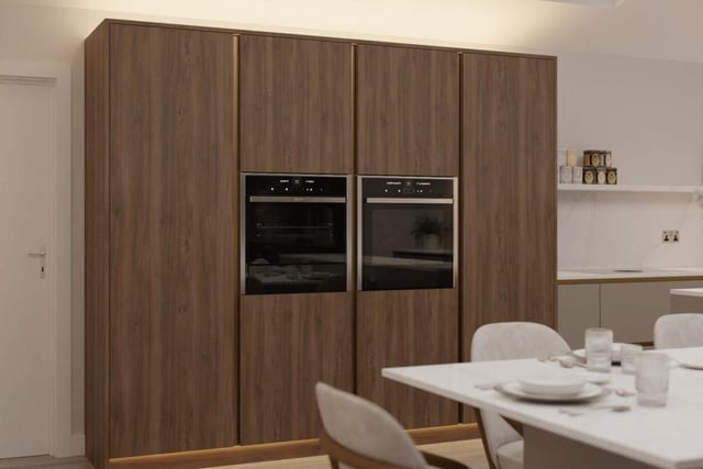 Integrated appliances aplenty adorn the dining kitchen