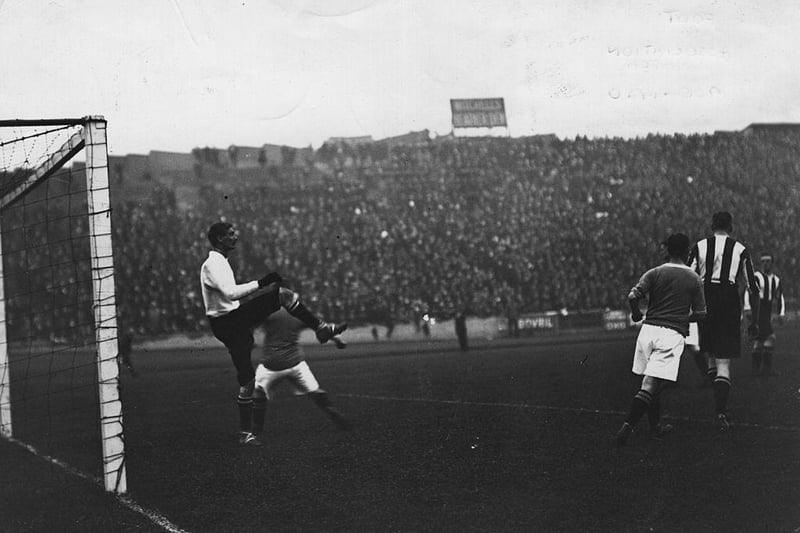 Notts County's goalkeeper saves a shot from Chelsea during their match at Stamford Bridge in September 1909.