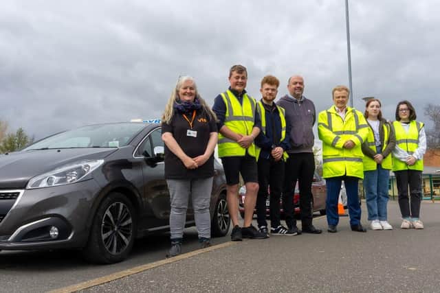 Coun Neil Clarke joins participants and instructors at the young driver training session