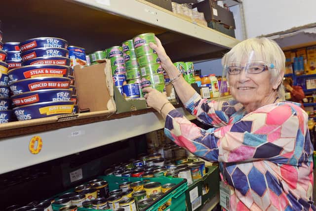 Yvonne Campbell  checks stock at Hucknall food bank, which is restarting the Hucknall Donates scheme