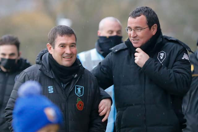 Stags boss Nigel Clough speaks with Salford manager Gary Bowyer before Mansfield's 2-1 win on Saturday.