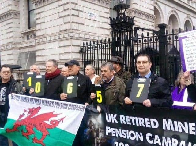 Former mineworkers outside Downing Street in 2019 after handing in a 100,000-strong petition calling for a fairer pension deal.