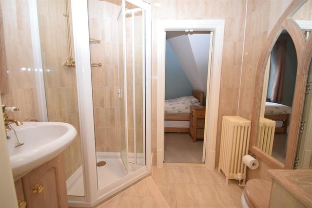 The second floor has its own shower room, which comprises a fitted shower cubicle, wash basin in a vanity unit and low-flush WC. The floor and walls are decorated with modern tiling.