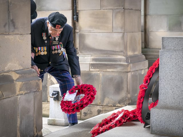 101-year-old Second World War veteran Jack Ransom lays a wreath during the Remembrance Sunday service at the Stone of Remembrance outside Edinburgh City Chambers in Edinburgh.