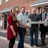 An Ashfield housing officer, council leader Coun Jason Zadrozny and Coun Andy Meakin welcome another new tenant to their council home. Photo: ADC