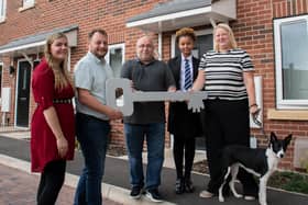 An Ashfield housing officer, council leader Coun Jason Zadrozny and Coun Andy Meakin welcome another new tenant to their council home. Photo: ADC