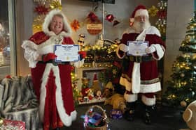 Santa and Mrs Claus with their Hucknall Hero certificates