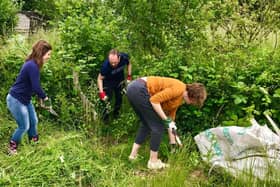 The university’s team took part in a recent volunteering day at Summerwood Community Garden to learn more about the journey to slashing carbon emissions