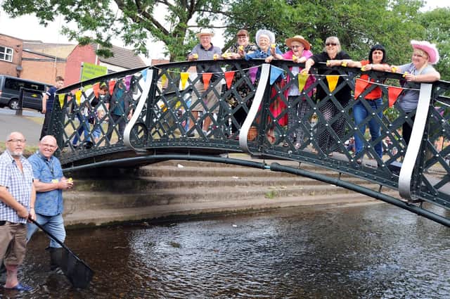 Members of the Friends of Bulwell Bogs prepare to launch a duck race at the park