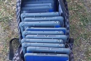 Thirteen Apple iPads were found in a rucksack.
