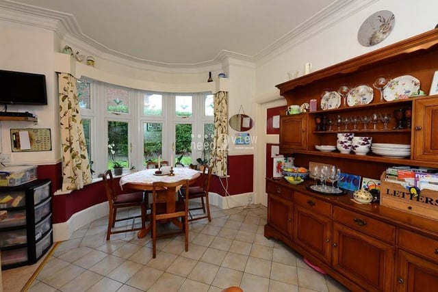 Part of the kitchen houses this charming dining area, where there is space for a dining table in front of another bay window, which overlooks the garden.