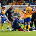 George Maris receives treatment during the match against Oldham Athletic Photo by: Chris Holloway/The Bigger Picture.media