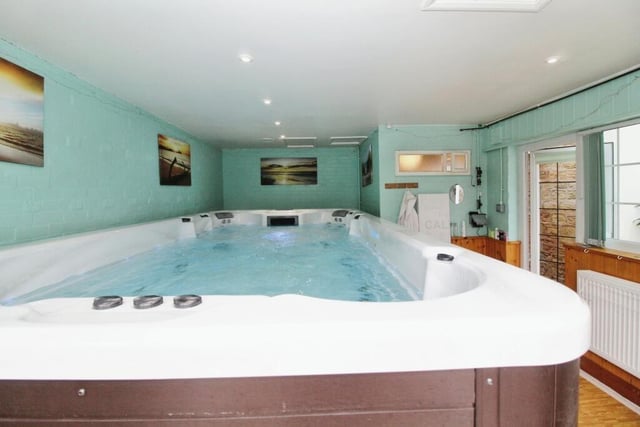 Adjoining the conservatory is this luxurious Riptide Neptune swim spa, with a pool for exercising and six seating areas. Next to it is a convenient toilet, accessible from the garden.