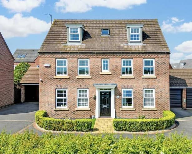 This eyecatching five-bedroom, three-storey family home on Lucilla Close in Hucknall, overlooking Papplewick Green playing fields, is on the market with estate agents HoldenCopley, who are inviting offers in the region of £525,000.
