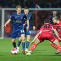 Two-goal hero George Lapslie looks for a way through the Doncaster defence during today's Emirates FA Cup second round win at the Keepmoat Stadium. Photo by Chris Holloway/The Bigger Picture.media
