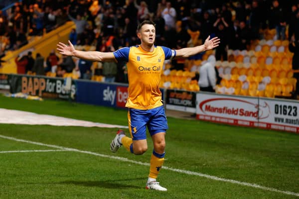 Captain Ollie Clarke runs towards the Mansfield fans after netting his second goal of the match at the One Call Stadium today. Photo by: Chris Holloway / The Bigger Picture.media