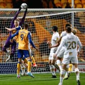 Mansfield Town forward Rhys Oates puts the Port Vale keeper under pressure. Pic - Chris Holloway/The Bigger Picture.media