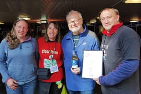 Gail (left) and Ray Blockley (second right) of Torkard Cider receiving their medal from Nottingham CAMRA