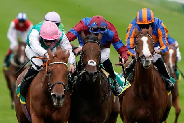 The 1000 Guineas favourite, Quadrilateral (left), wins a Group One race at Newmarket last season. (Photo by Alan Crowhurst/Getty Images)