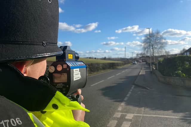 A police officer uses the speed gun during the Hucknall Fatal 4 operation