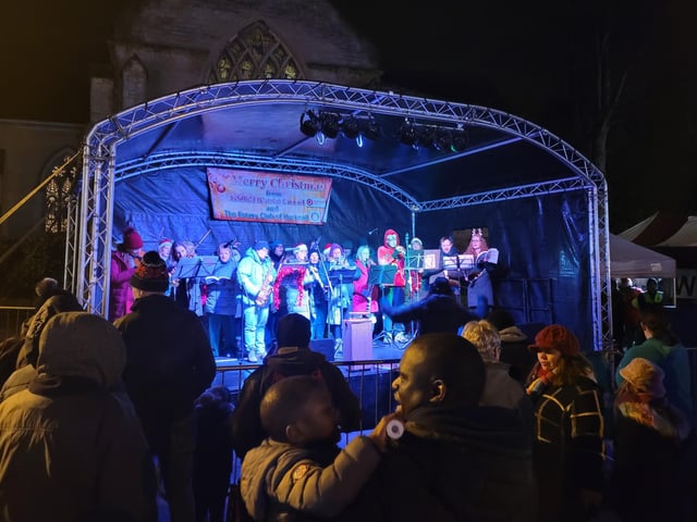 Crowds enjoy the Torkard Ensemble choir and orchestra's performance