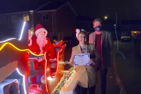 Dan Beeston (centre) with Santa and Coun Phil Rostance