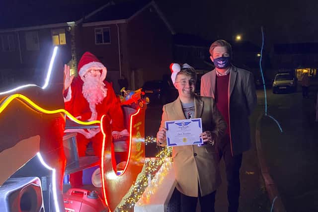Dan Beeston (centre) with Santa and Coun Phil Rostance