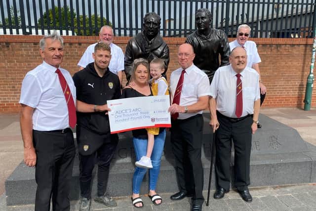 Members of Bestwood MVC presenting the cheque to Matt and Kirsty Hallam, together with Leila, are Peter Fletcher (publicity officer), Gary Hallam (concert secretary), John Pritchard (president), Colin Pursglove (chairman) and Bryce Clare (secretary)
