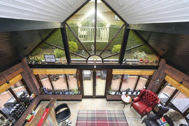 This shot from on high gives a real insight into the unique design of The Arches. It is a view from the second-floor open mezzanine landing/lounge overlooking the brick-built conservatory/bar, which has a feature vaulted ceiling and tiled flooring.