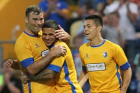 Liam Hearn is congratulated after scoring for Mansfield Town.