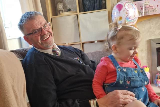 Neil is pictured with his granddaughter Harper-Rose.