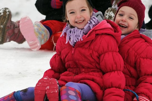 Pictured enjoying the snow at Titchfield Park are six-year-old twins Ruby and Scarlett Waller.