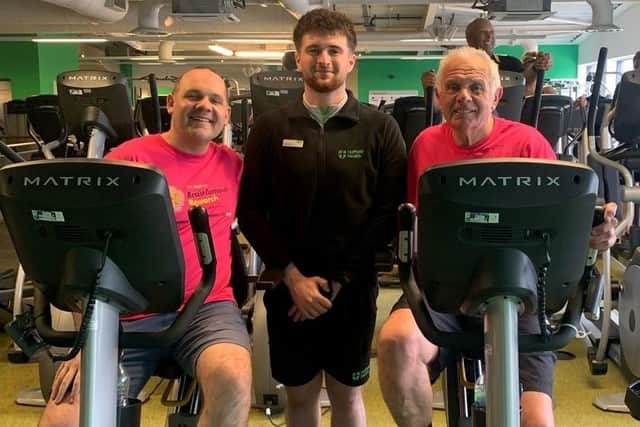 Darryl Claypole and his son Tom with coach George Healey in training for their epic cycle challenge