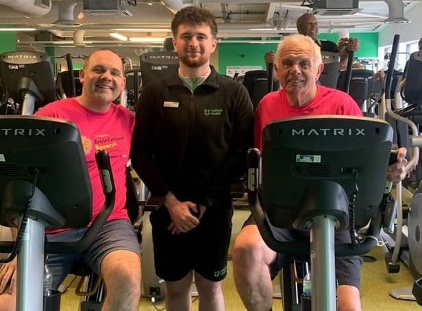 Darryl Claypole and his son Tom with coach George Healey in training for their epic cycle challenge