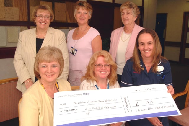 The Inner Wheel Club of Mansfield raised £750 from various events including an Around Britain Quiz Night for the Kings Mill Hospital Welcome Treatment Centre Breast Unit. (As of 2006) President Vivienne Brown, seated left, presents the cheque to Shelley Cosford Office Manager and Penny Stinchcombe - Superintendent Radiograppher, seated right, watched by Inner Wheel members, from back left; Veronica Malkowski Junior Vice President, Elaine Campin and June Lane Secretary.
