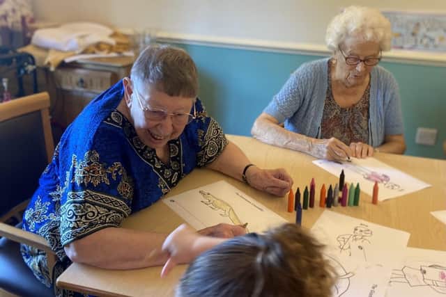 Residents enjoying their time with the children from Rocking Horse Nursery. (Photo by: Hall Park Care Home)