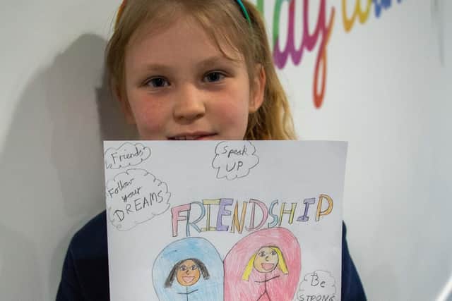 Year four pupil Rose Hancocks with her poster design. Photo: Lou Brimble