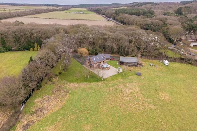 Before we step inside the property itself, this aerial shot gives a bird's eye view of the sprawling nine-acre estate it sits on. Woodland and meticulously landscaped gardens create endless possibilities for outdoor pursuits.