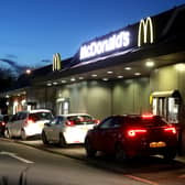 Customers queue at a McDonald's drive through restaurant (Photo by David Rogers/Getty Images).
