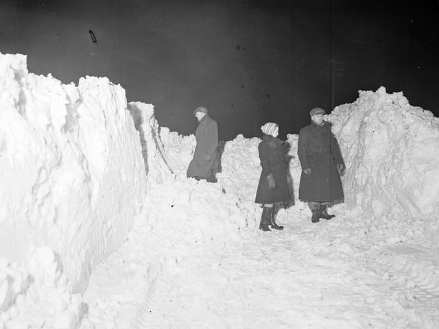 Eight foot snow drifts block Old Lanark Road, near Balerno, in February 1955.
